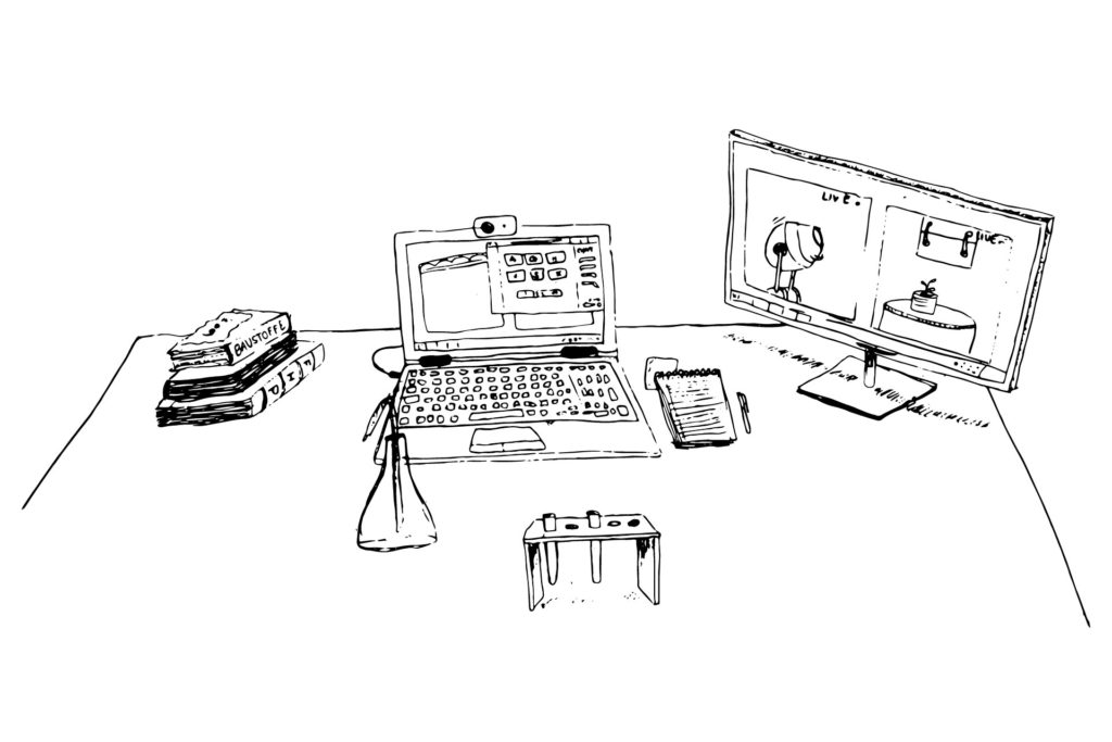 Schreibtisch mit Laptop, Kamera und Laborinstrumenten